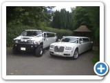 White Hummer Limousine and Baby Bentley Limousine sat in the sun waiting to whisk you and your family to the big day