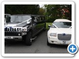 our black hummer and chrysler 300 stretched limousines all dressed fo rthe big wedding day to take you and your guests to the church on time