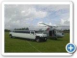 white hummer sat with lynx helicopter two big rides for the special day